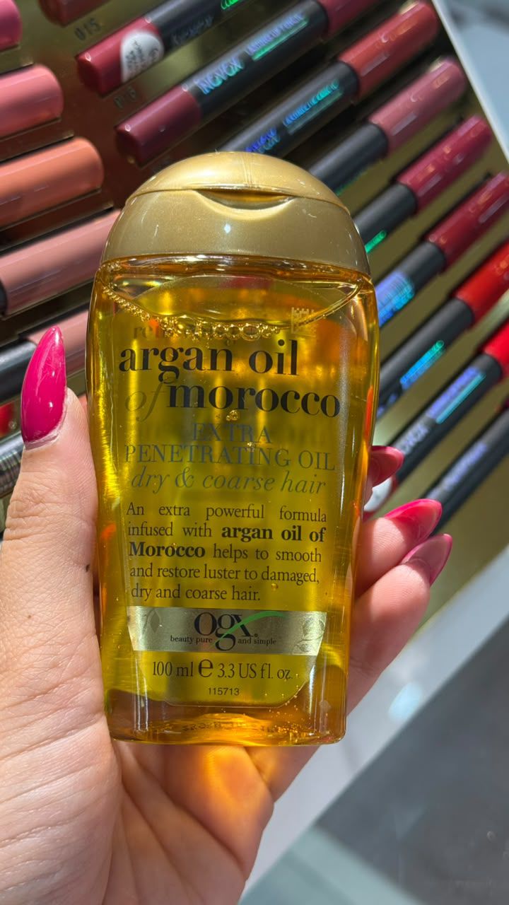 روغن مو جی ایکس مدل Argan حجم 100 میلی لیتر مناسب موهای خشک و آسیب دیده